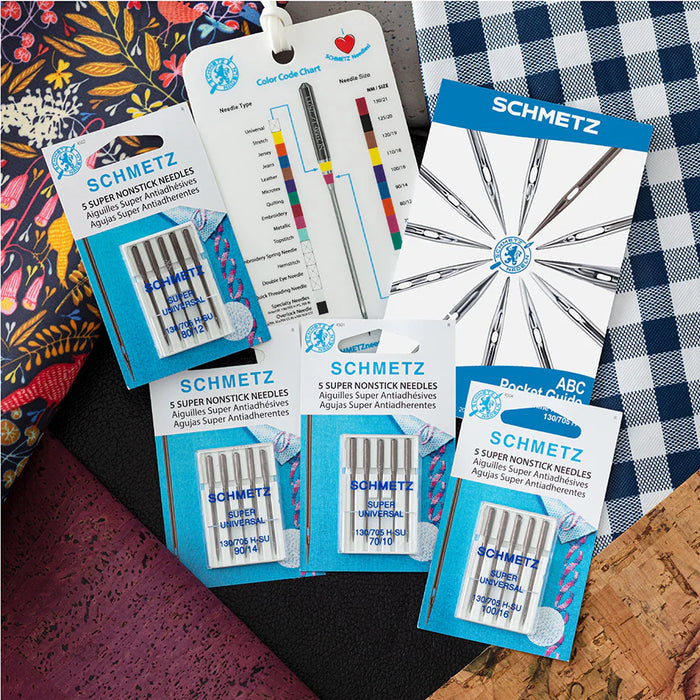 Super Non-Stick bundle of Schmetz needle packages on a checkered fabric background