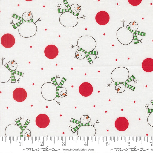 Snow Time Winter White Snowman fabric shown beside a ruler to display the print scale and repeat width