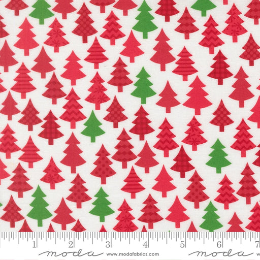 Snow Time Poinsettia Red Christmas Trees fabric shown beside a ruler to display the print scale and repeat width