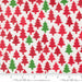 Snow Time Poinsettia Red Christmas Trees fabric shown beside a ruler to display the print scale and repeat width