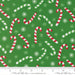Snow Time Evergreen Candy Cane fabric shown beside a ruler to display the print scale and repeat width