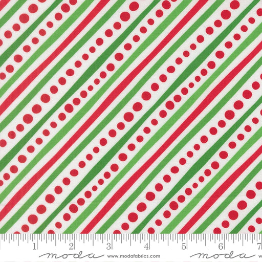 Snow Time Winter White Dotted Bias Stripe fabric shown beside a ruler to display the print scale and repeat width