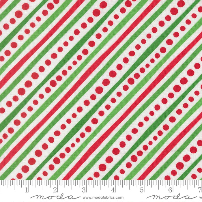 Snow Time Winter White Dotted Bias Stripe fabric shown beside a ruler to display the print scale and repeat width