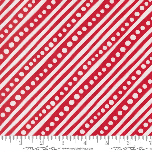Snow Time Poinsettia Red Dotted Bias Stripe fabric shown beside a ruler to display the print scale and repeat width