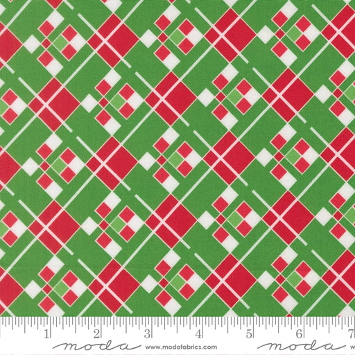 Snow Time Evergreen Plaid fabric shown beside a ruler to display the print scale and repeat width