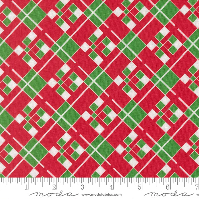 Snow Time Poinsettia Red Plaid fabric shown beside a ruler to display the print scale and repeat width