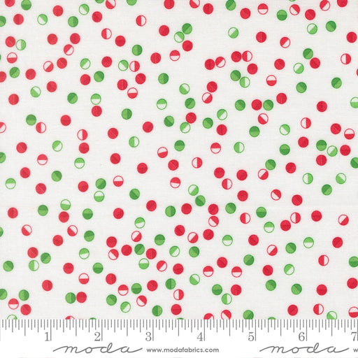 Snow Time Winter White Jolly Dots fabric shown beside a ruler to display the print scale and repeat width
