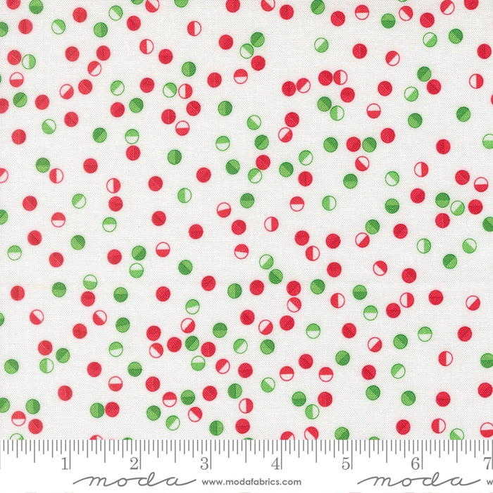 Snow Time Winter White Jolly Dots fabric shown beside a ruler to display the print scale and repeat width