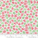 Snow Time Winter White Tinsel fabric shown beside a ruler to display the print scale and repeat width