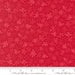 Snow Time Poinsettia Red Tinsel fabric shown beside a ruler to display the print scale and repeat width