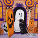 Embroidered design with Halloween elements including pumpkins, a ghost, and a black cat.