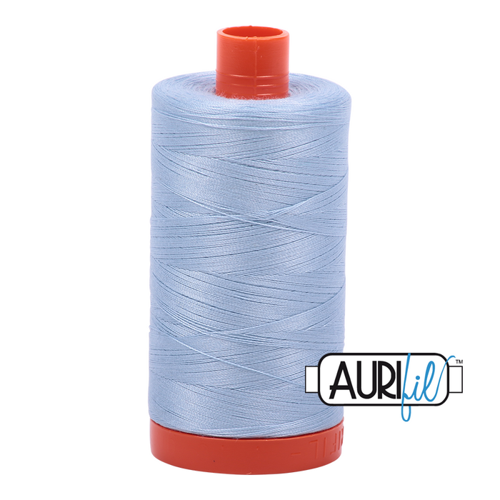 A spool of Aurifil 50wt light robins egg colored thread.