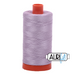 A spool of Aurifil 50wt lilac thread with a red cap.