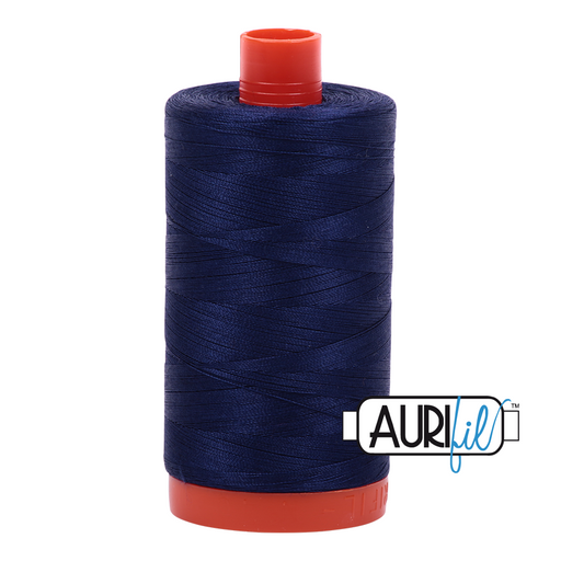 A spool of Aurifil 50wt cotton thread in color Midnight 2745.