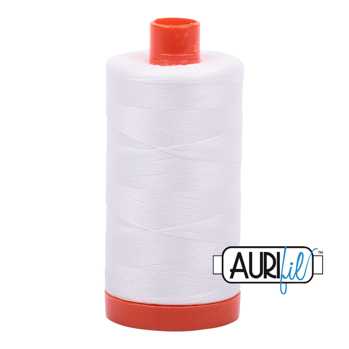 A spool of Aurifil 50wt natural white cotton thread with an orange cap on a white background.