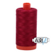 A spool of Aurifil 50wt red wine colored thread.