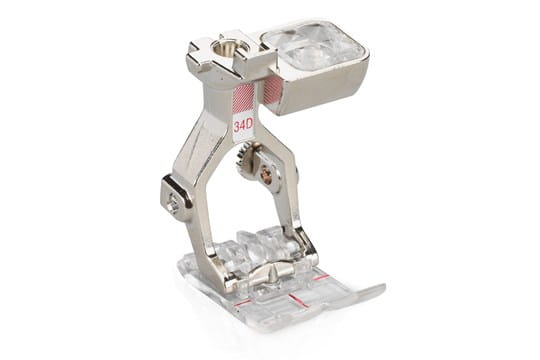 Bernina #34D Reverse Pattern Presser Foot with a clear sole, designed for precision stitching with visibility of the needle area.