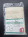 Packaged Easy Sew pillow blank with clear plastic wrapping on a dark background