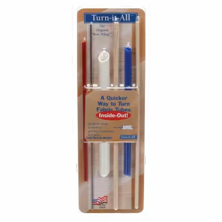 Packaging of 'Turn-it-All' fabric tube tools with red, white, and blue colors on a beige background.