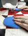 Person using a Gypsy Quilter's Grip & Stitch quilting disks on a quilt for free motion quilting