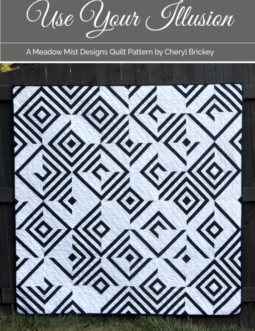 Quilt with black geometric pattern on white background, titled 'Use Your Illusion' by Cheryl Brickey.