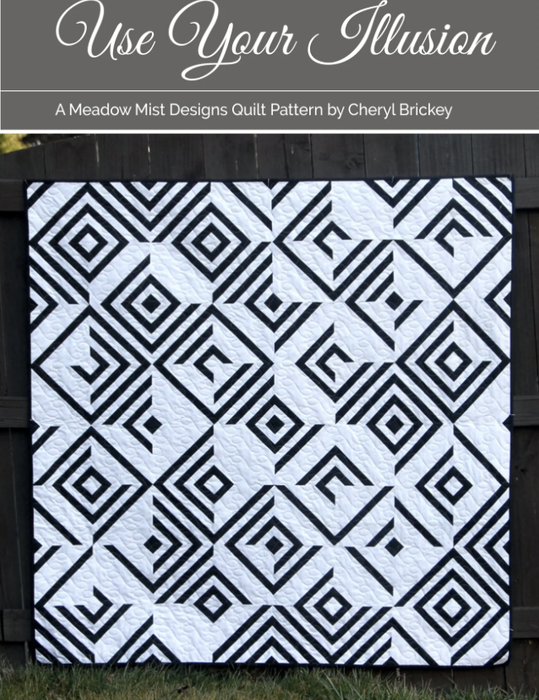 Quilt with black geometric pattern on white background, titled 'Use Your Illusion' by Cheryl Brickey.