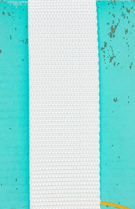 Textured white polypro strapping between two turquoise panels with specks on a textured blue background