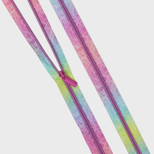 Two colorful zippers with a paisley pattern on a white background from Tula Pink's Floral Reef collection Making Waves