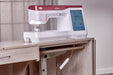 Baby Lock Anthem machine on a sewing cabinet