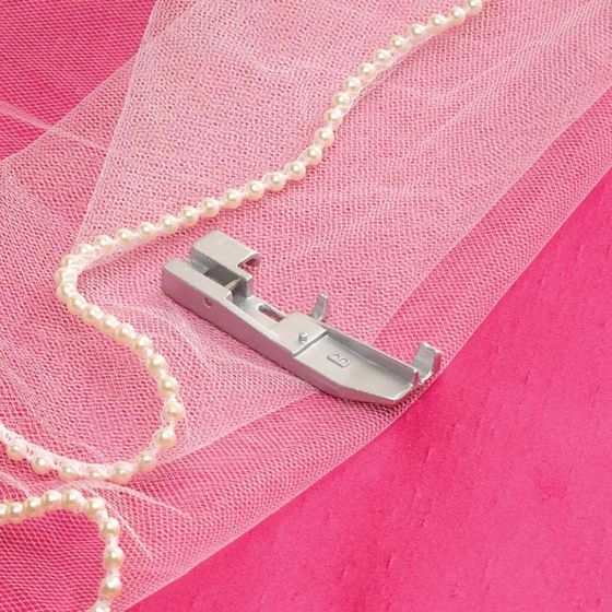 Baby Lock Beading Foot BLE-BF on pink fabric with lace and beading