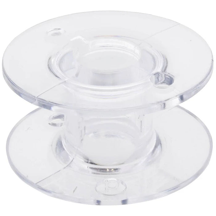 Clear plastic class 15 bobbin on a white background