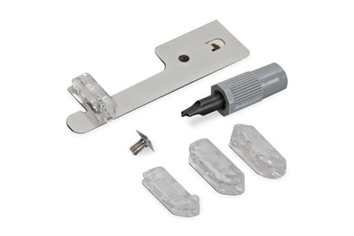 The image shows Bernina #47 Spanish Hemstitch Attachment, including a metal presser foot, a sewing machine needle, and two fabric pieces.