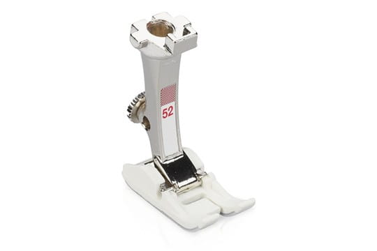 Bernina #52 zigzag presser foot with a non-stick sole, primarily white in color with some black detailing.