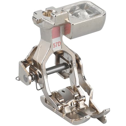 A BERNINA #57D Patchwork with 1/4 Guide foot made of metal, primarily silver in color, designed for quilting and precision sewing.