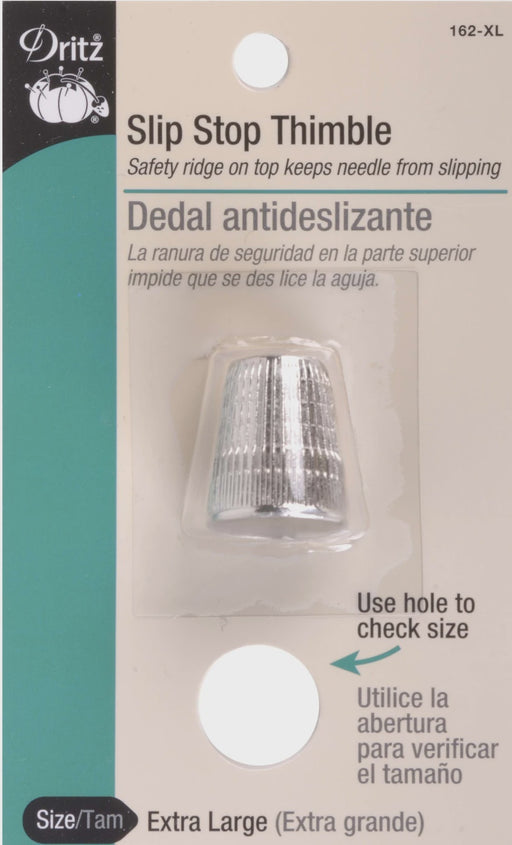 Dritz Slip Stop Thimble packaging with silver thimble on a beige background