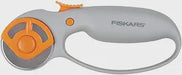 Fiskars rotary cutter with orange wheel on a white background