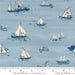  Longshore Marine Day quilting fabric by Janet Clare. 100% cotton fabric with a sailboat pattern on a light blue background. Ideal for coastal-themed projects.