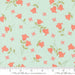 Floral pattern with pink flowers on a light blue background, featuring Moda label.
