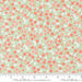 Floral fabric pattern with a ruler for scale on a light green background