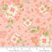 Floral pattern fabric with a ruler for scale on a pink background