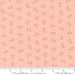 Floral pattern fabric swatch on a pink background with Moda label.