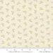 Floral patterned fabric with a ruler for scale on a beige background