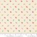Fabric with small floral pattern on a beige background, featuring Moda label.
