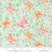 Butterfly pattern fabric with a ruler for scale on a light green background