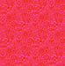 Patterned fabric with red floral design on a pink background