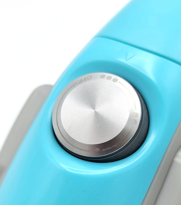 Close-up of a blue electronic device with a silver knob on a white background