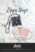 The image shows the cover of the sewing pattern for Zippy Crossbody Bags by Sallie Tomato, featuring two finished bags on a marble background.