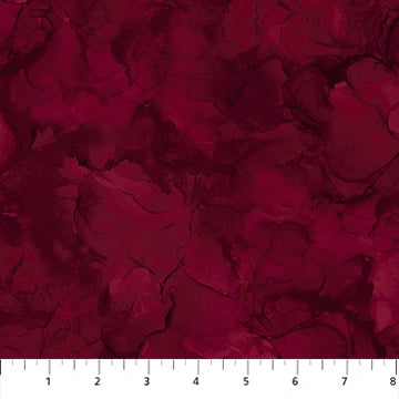 Mirage Sangria quilting cotton by Deborah Edwards for Northcott — deep wine red fabric shown with ruler for scale